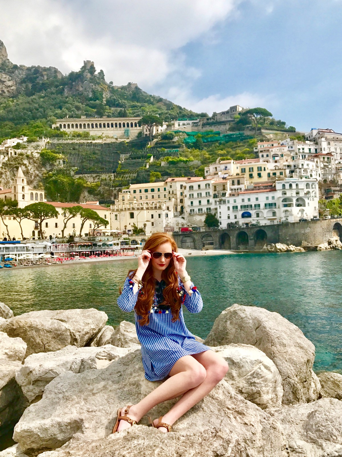 Amalfi taking off sunglasses